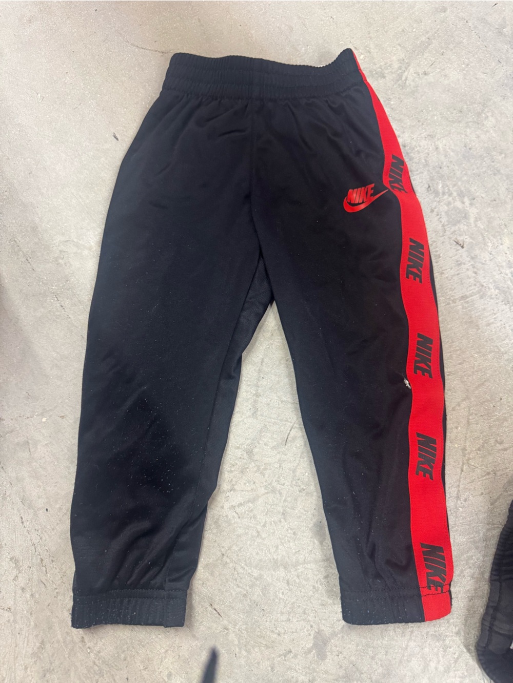 Nike Black Joggers with Red Logo Stripe - Kids